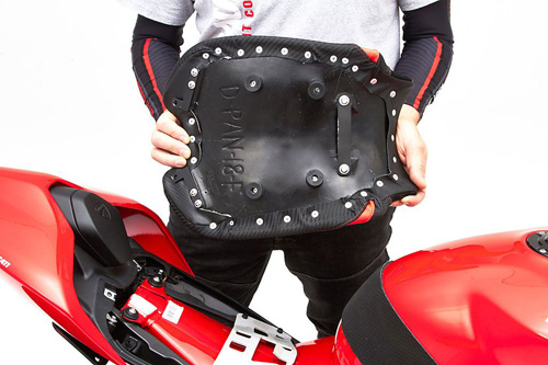 a person holding Front seat showing the back side, MPN printed and mounting brackets pre-installed