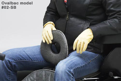 a person is sitting on rear seat with holding ovalbac backrest 02-SB model