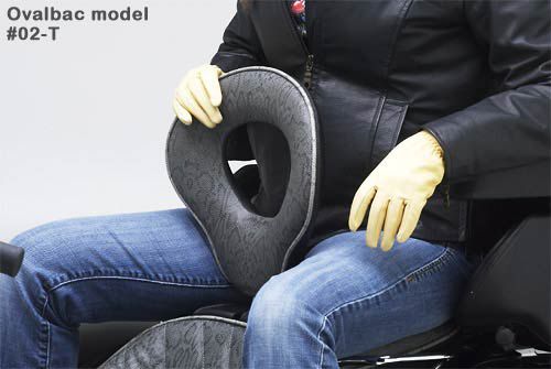 a person is sitting on rear seat with holding ovalbac backrest 02-T model