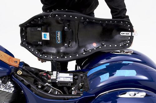 a person holding Front & Rear seat showing the back side, MPN printed and mounting brackets pre-installed