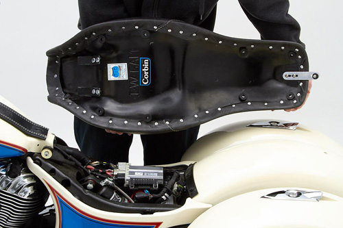 a person holding Widowmaker seat showing the back side, MPN printed and mounting brackets pre-installed