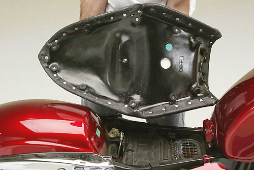 a person Fast Gun seat showing the back side mounting brackets pre-installed