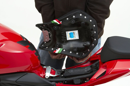 a person holding Front seat showing the rear side, MPN printed and mounting brackets pre-installed