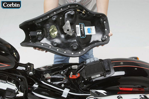 a person holding Hollywood Solo seat showing the rear side, MPN printed and mounting brackets pre-installed