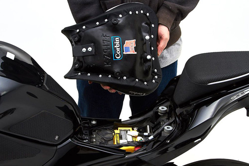 a person holding Front seat showing the rear side, MPN printed and mounting brackets pre-installed