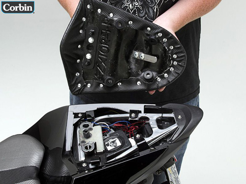 a person holding Rear seat showing the back side, MPN printed and mounting brackets pre-installed