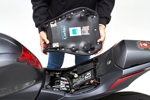 a person holding Front seat showing the rear side, Corbin and America's Flag sticker printed and mounting brackets pre-installed