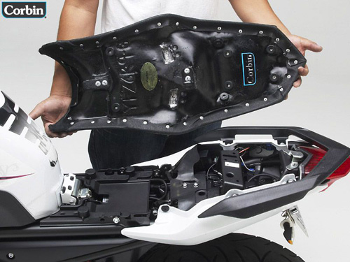 a person holding Gunfighter seat showing the rear side, MPN printed and mounting brackets pre-installed