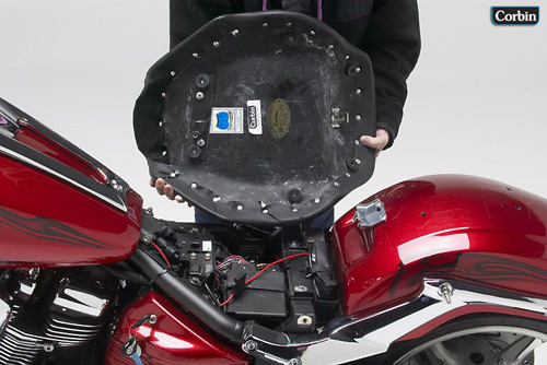 a person holding Hollywood Solo seat showing the rear side, MPN printed and mounting brackets pre-installed