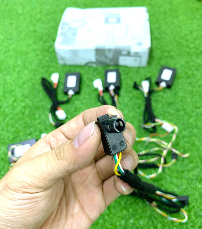 rear camera in hand with harness and connector