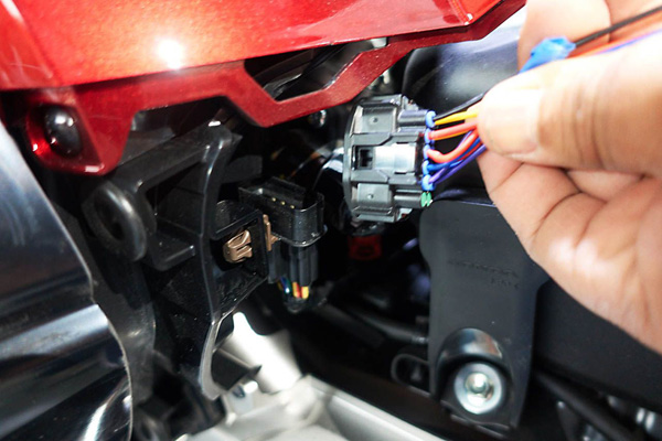 a plug is being integrated with the stock wiring harness for simple plug-n-play heater installation