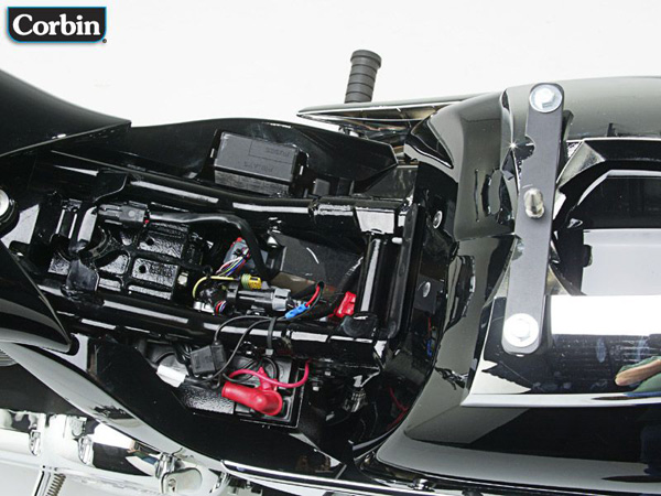 Corbin bracket with latch pin to the rear fender using the supplied hex head bolts and washers