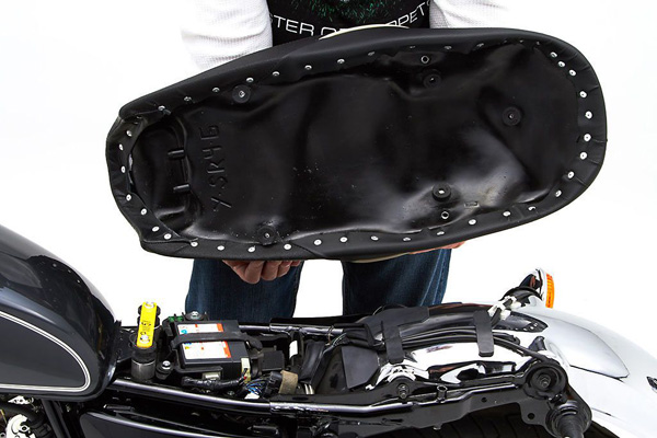 a person holding Gunfighter seat showing the rear side with MPN printed