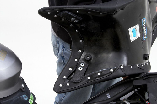 two leather covered steel tongues shown that hook onto the front mounting points instead of the keyhole slots