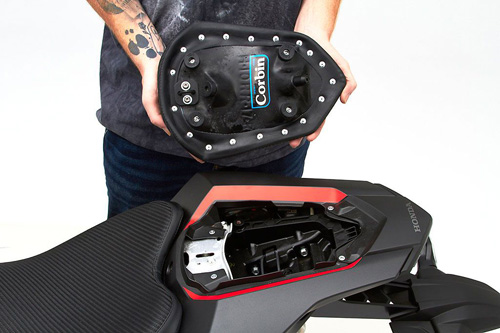 a person is holding rear seat showing rear side MPN printed and mounting brackets pre-installed
