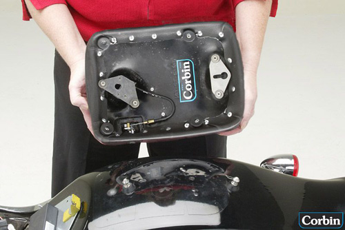 a person is holding rear seat showing rear side with keylock system pre-installed