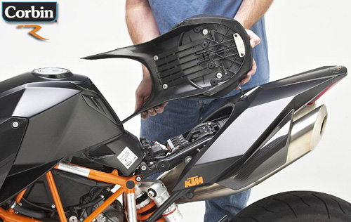 a person is holding seat showing rear side MPN printed and mounting bracket pre-installed